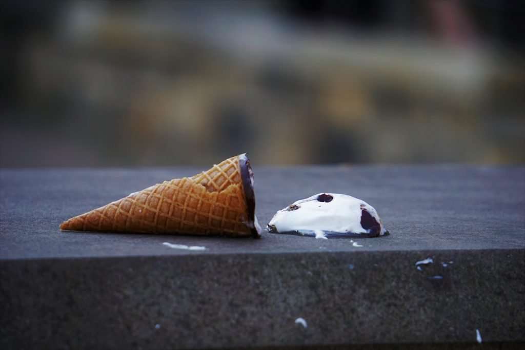 Losing an ice cream cone by dropping it.