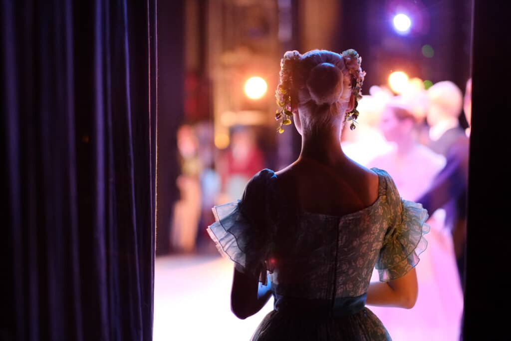 A ballerina awaiting the moment of entering the stage in the pla
