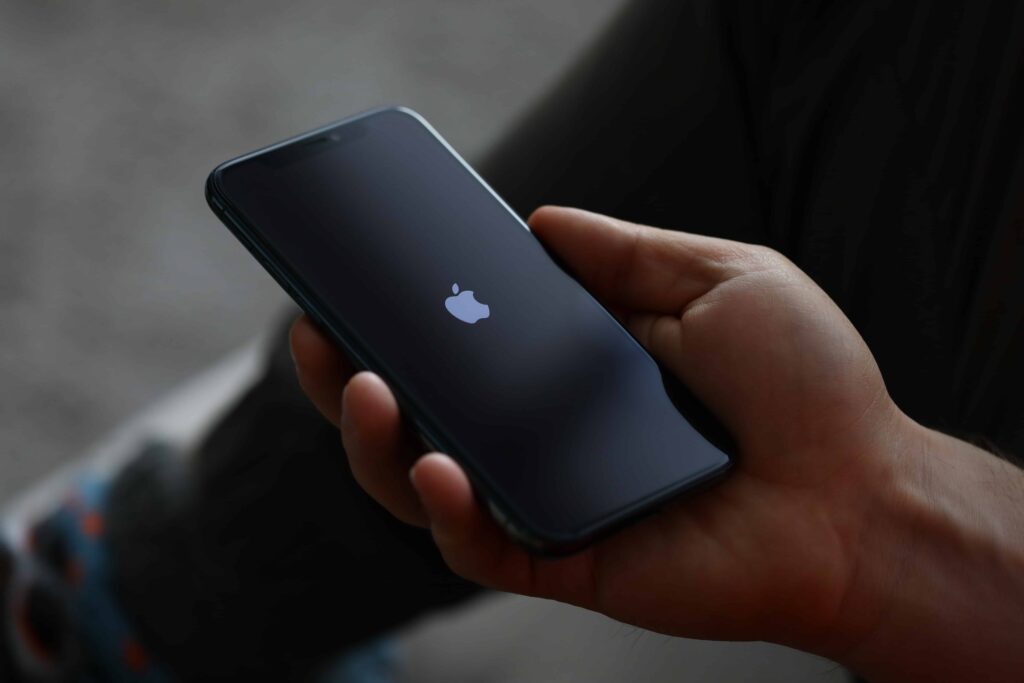 AdobeStock_309035736_Editorial_Use_Only (2) Iphone in person's hand