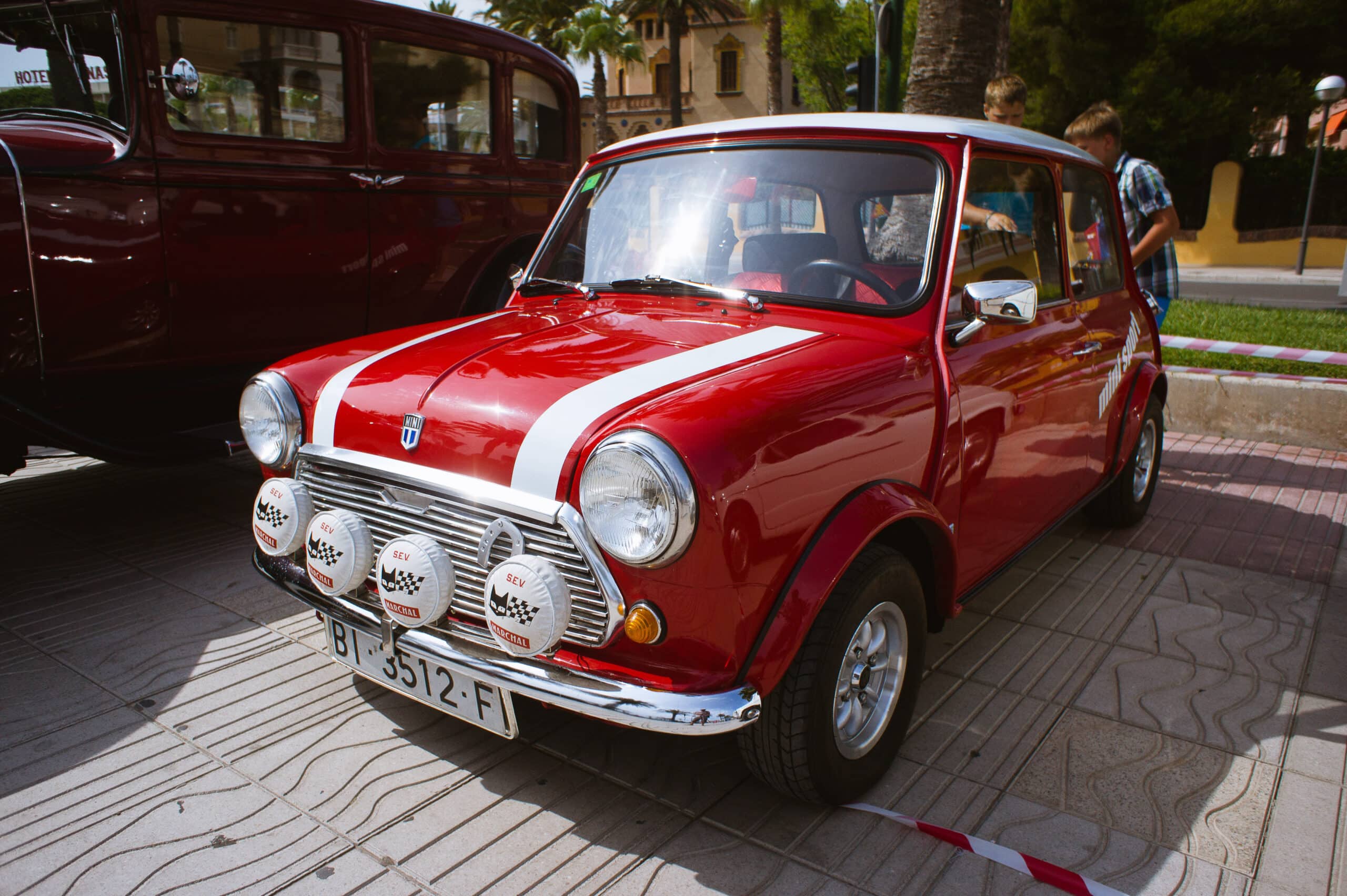 Salou Spain - July 2013 Red retro Mini Cooper car stands on di Salou Spain - July 2013 Red retro Mini Cooper car stands on di
