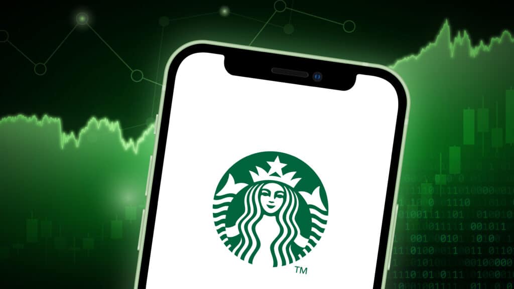 A smartphone displaying the Starbucks logo on its screen is set against a green background with financial graphs and binary code, suggesting a theme of business or stock market activity.